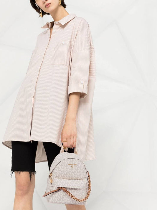 Cuero | Small Rhea Monogram print backpack in offwhite