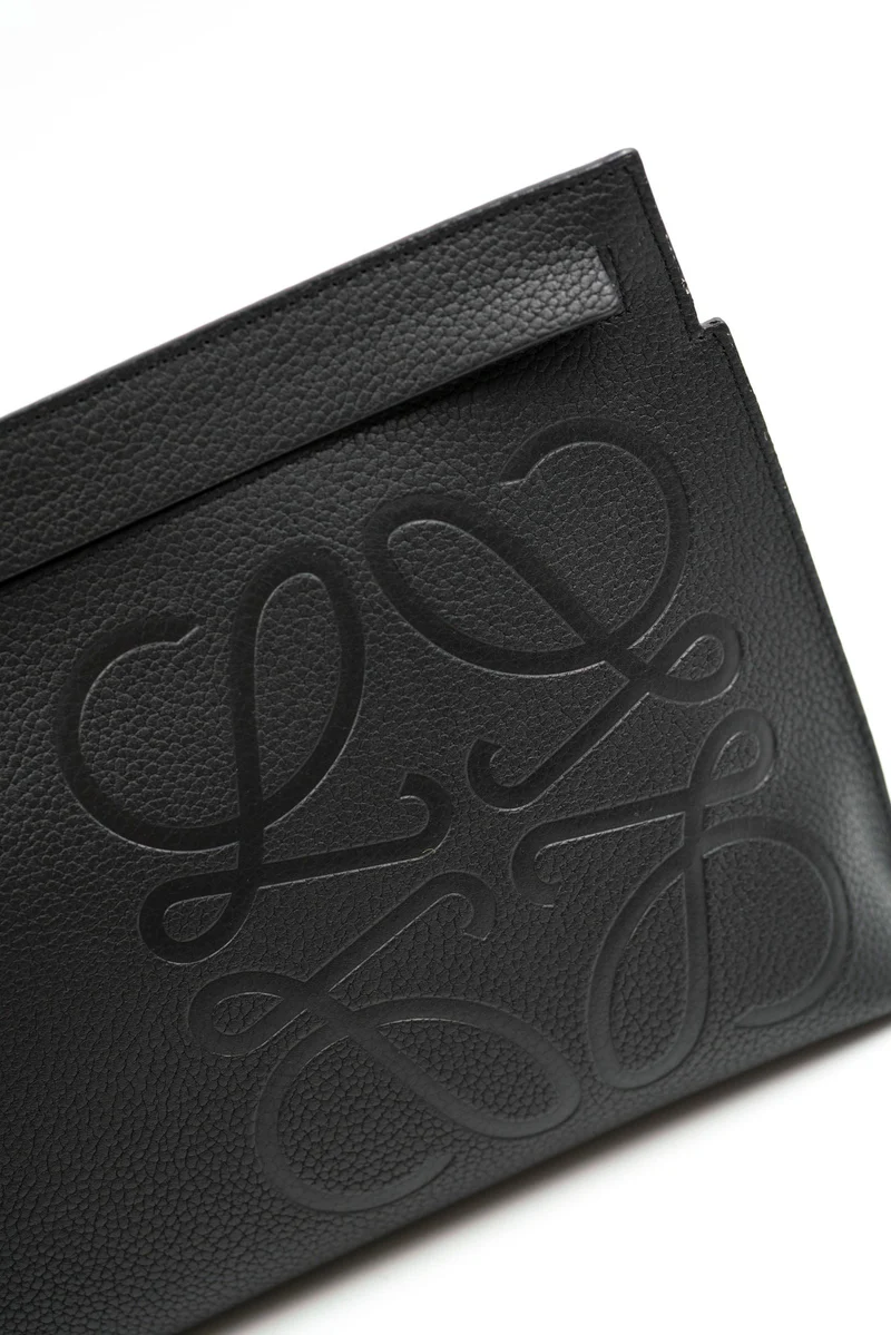 Cuero | black grained leather logo clutch