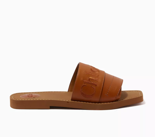 Cuero | Woody Logo Slide Sandals in Calfskin