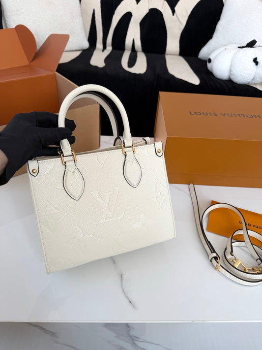 Cuero | Embossed Monogram Charm Chain Tote Bag - Cream White