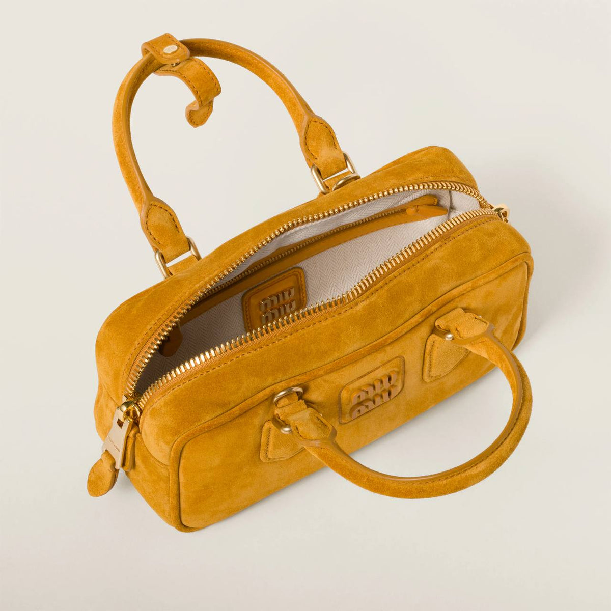 Cuero | Arcadie padded suede top-handle bag in Whiskey