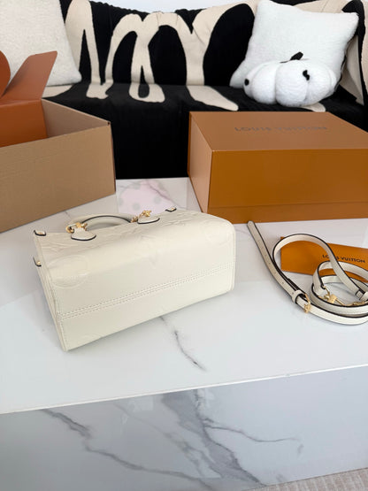 Cuero | Embossed Monogram Charm Chain Tote Bag - Cream White