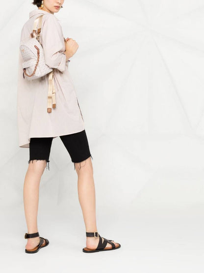 Cuero | Small Rhea Monogram print backpack in offwhite