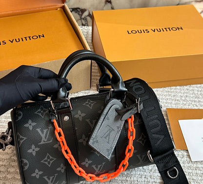 Cuero | Signature Monogram Duffle Crossbody Bag - Eclipse Black with Neon Chain