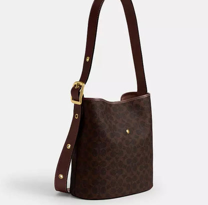 Cuero | BLEECKER BUCKET BAG IN SIGNATURE CANVAS