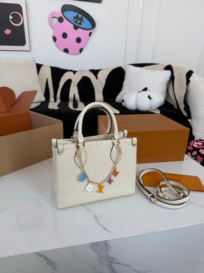 Cuero | Embossed Monogram Charm Chain Tote Bag - Cream White