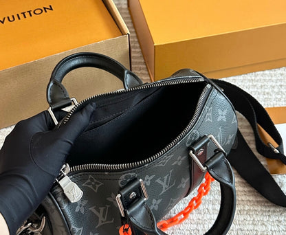 Cuero | Signature Monogram Duffle Crossbody Bag - Eclipse Black with Neon Chain