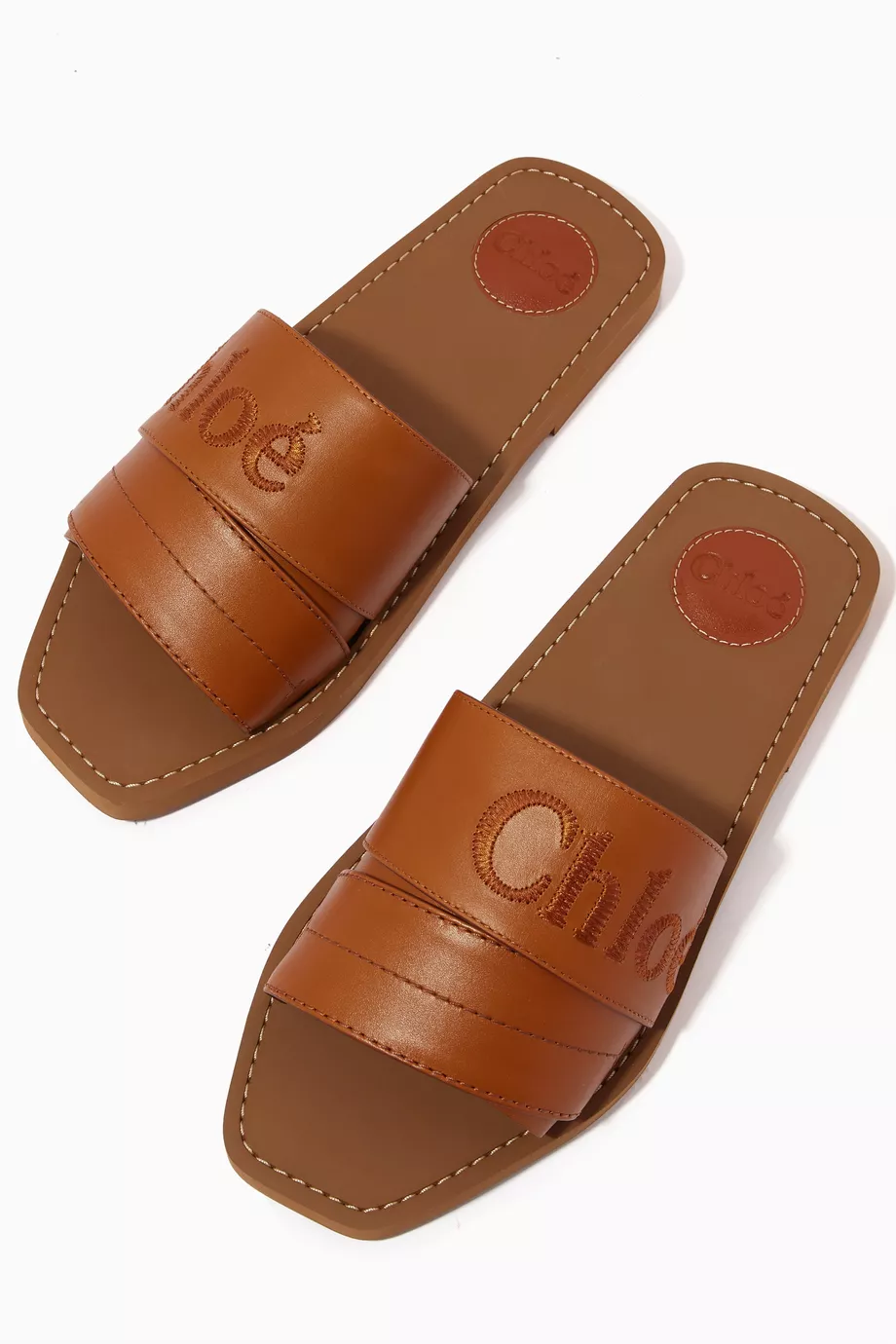 Cuero | Woody Logo Slide Sandals in Calfskin