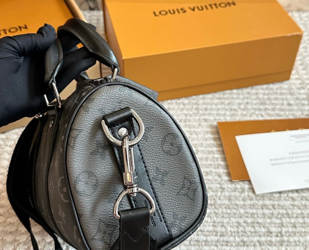 Cuero | Signature Monogram Duffle Crossbody Bag - Eclipse Black with Neon Chain