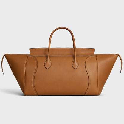 Cuero | SMILE LUGGAGE IN SUPPLE SHINY LAMBSKIN