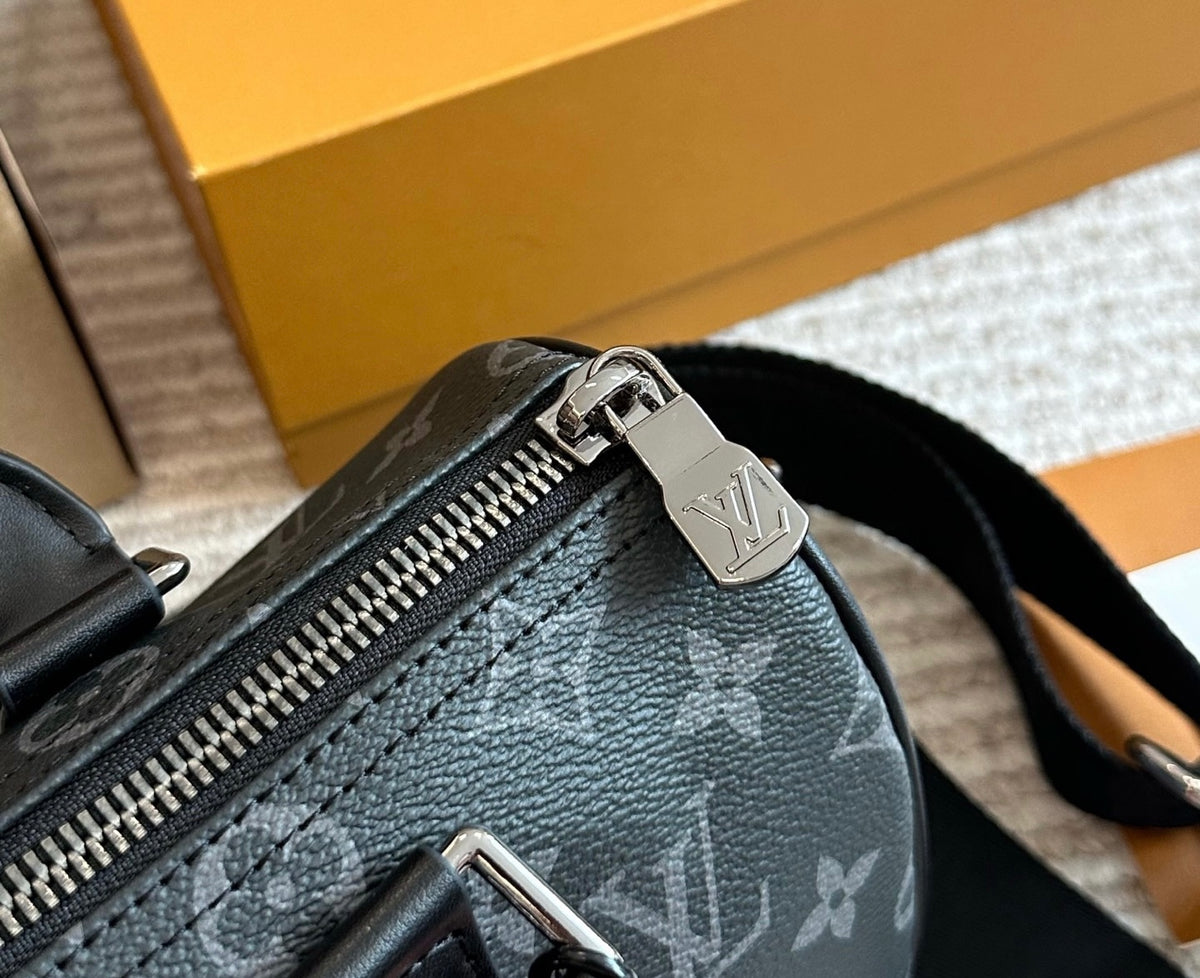 Cuero | Signature Monogram Duffle Crossbody Bag - Eclipse Black with Neon Chain