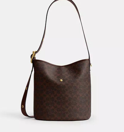 Cuero | BLEECKER BUCKET BAG IN SIGNATURE CANVAS