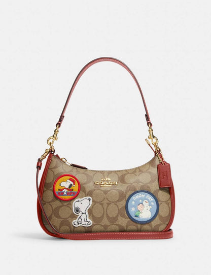 Cuero | X Peanuts Teri Shoulder Bag In Signature Canvas With Patches