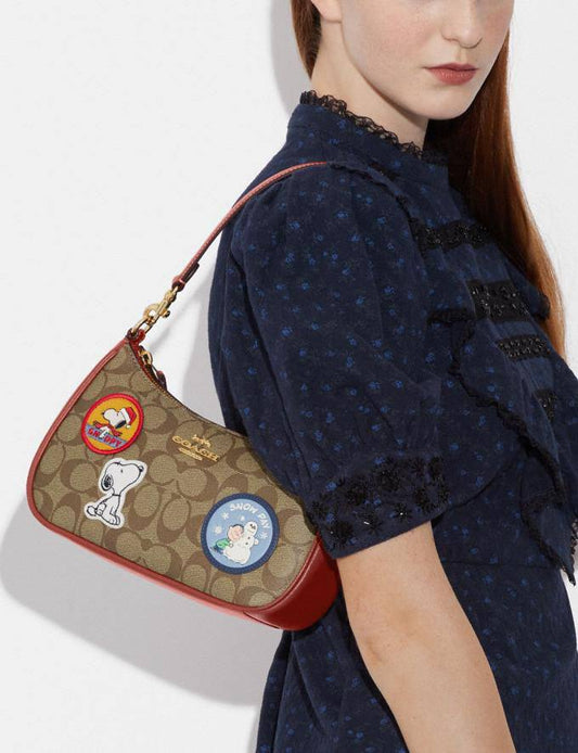 Cuero | X Peanuts Teri Shoulder Bag In Signature Canvas With Patches