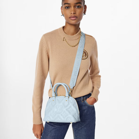 Cuero | VUITTON Banane' bubblegram Alma BB bag with detachable strap & gold metallic hardware