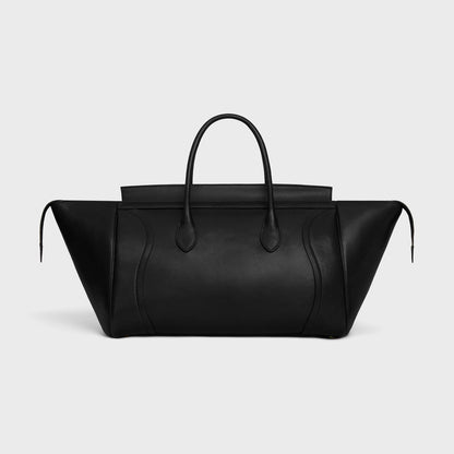 Cuero | SMILE LUGGAGE IN SUPPLE SHINY LAMBSKIN