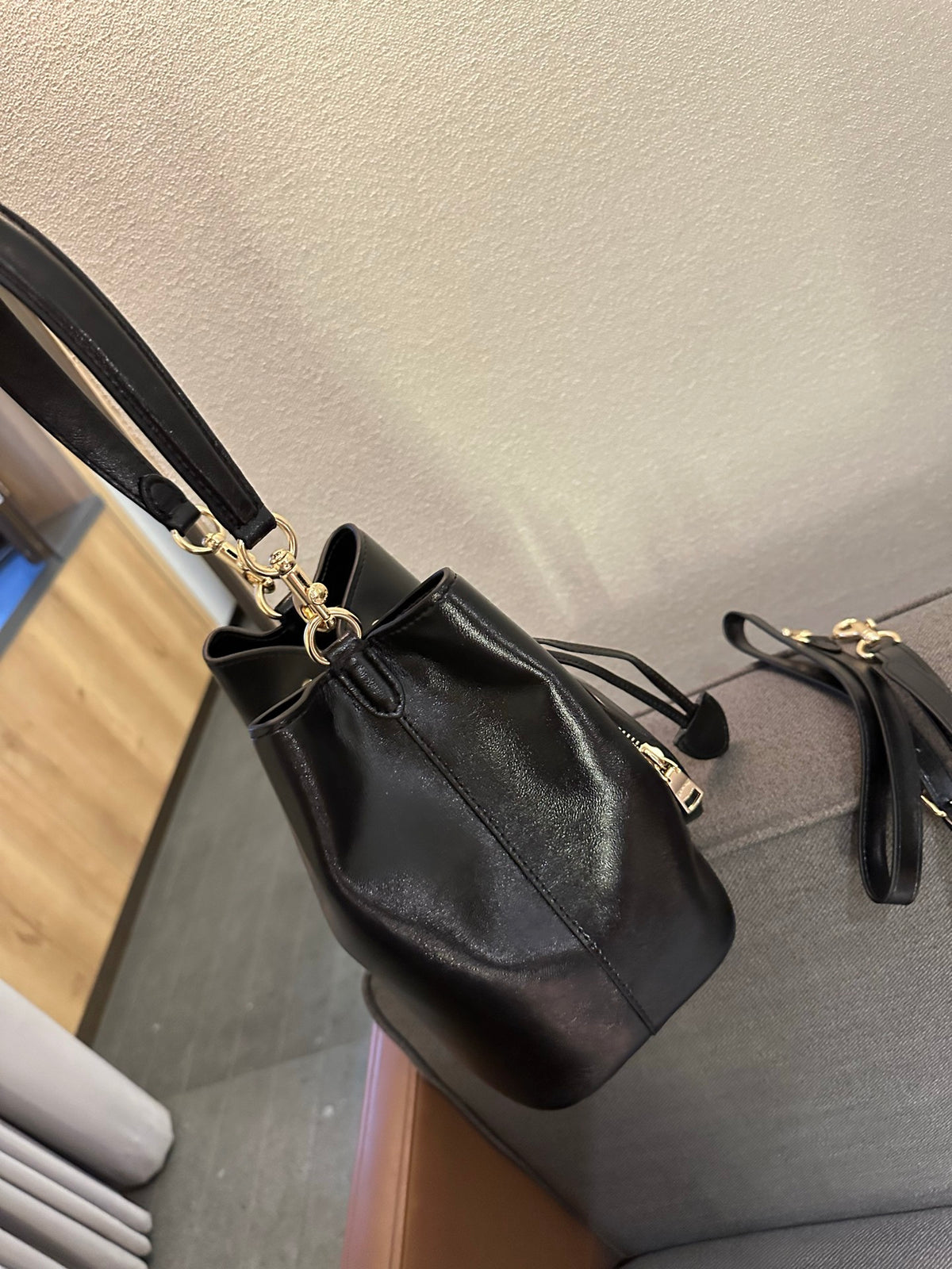 Cuero | Pebbled Leather Drawstring Bucket Bag with Front Pocket - Black