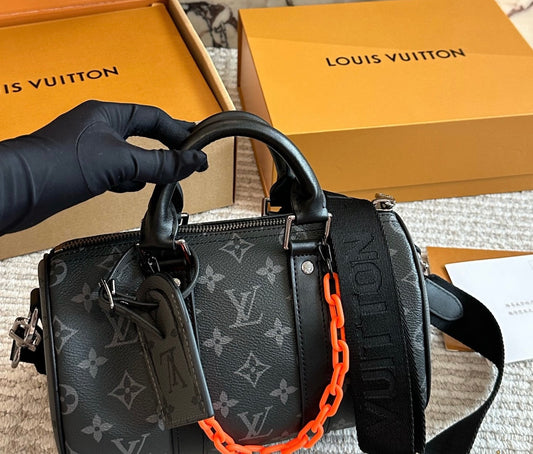 Cuero | Signature Monogram Duffle Crossbody Bag - Eclipse Black with Neon Chain