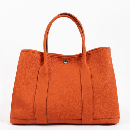 Cuero | Garden Orange Black Silver hardware K stamp