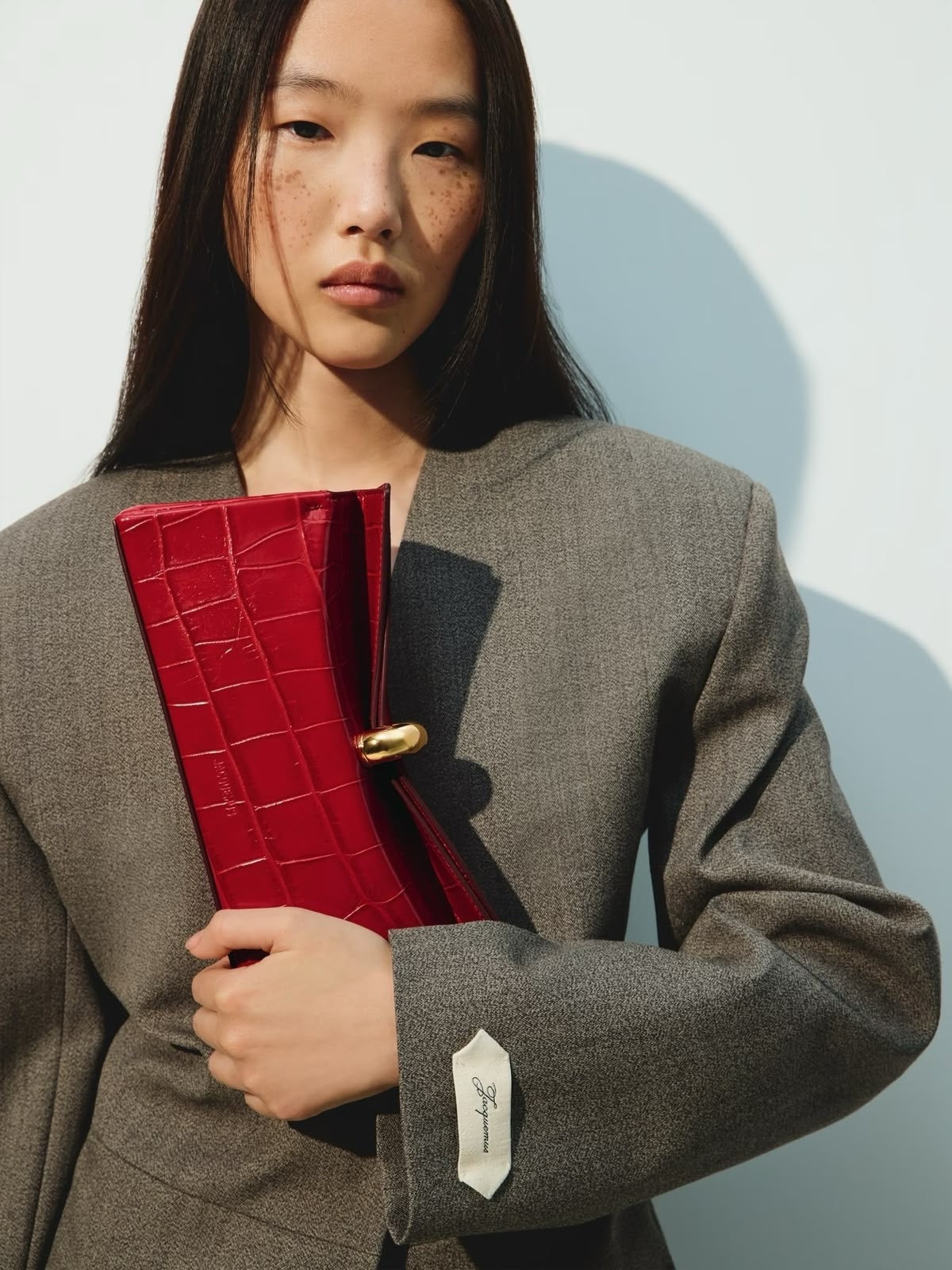 Jacquemus La Poupie Clutch – Red Crocodile Embossed Leather with Gold Hardware