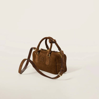 Cuero | Arcadie padded suede top-handle bag in Cocoa Brown