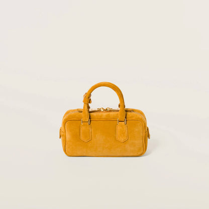 Cuero | Arcadie padded suede top-handle bag in Whiskey