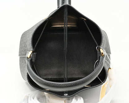 Cuero | SURI Small Logo Bucket Crossbody Black Signature Canvas